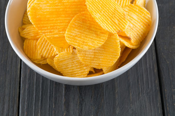 potato chips on wood background