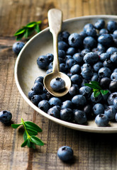 fresh blueberry in to the vintage metal plate