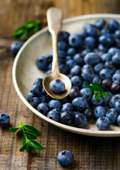 fresh blueberry in to the vintage metal plate