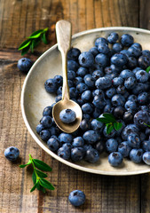 fresh blueberry in to the vintage metal plate