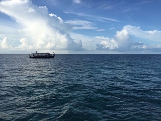 Boat floating on the ocean