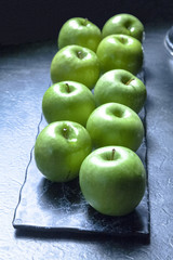 Green Apples On The Dark  Blue Backround