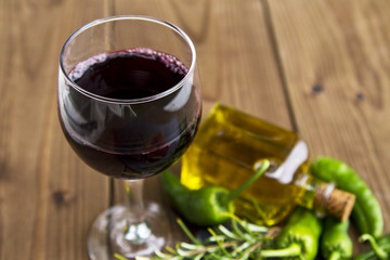 cup of wine with oil and peppers