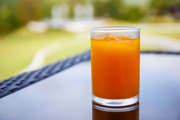 Orange juice in a glass on the table