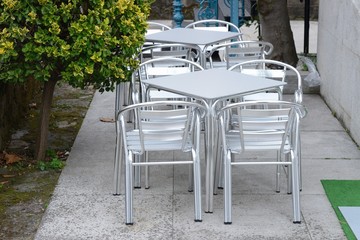 Empty tables of street cafe