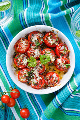 Roasted cherry tomatoes with cheddar cheese and Parmesan cheese, olive oil and aromatic herbs