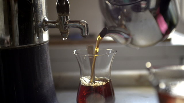 Filling tea and serving Traditional Turkish boyoz.
