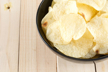 potato chips on wood background