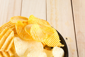 potato chips on wood background