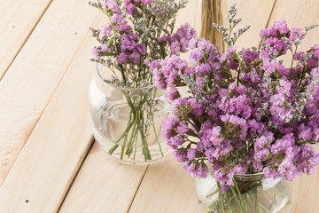 statice flower bouquet  on wood background