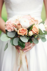 Wedding bouquet at bride's hands