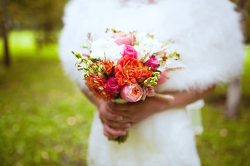 Wedding bouquet at bride's hands