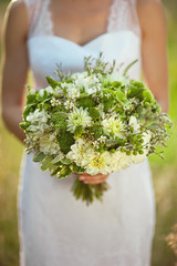 Wedding bouquet at bride's hands