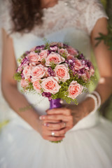 Wedding bouquet at bride's hands