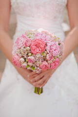 Wedding bouquet at bride's hands