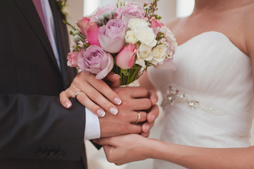 Wedding bouquet at bride's hands