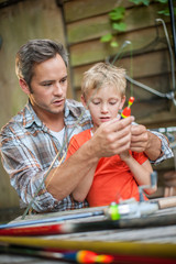 father and son preparing their fishing equipment