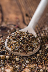 Crushed Peppercorns on a wooden spoon