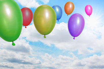 Balloons flying through the sky