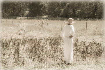 Artistic vintage edit of a girl in white on a field