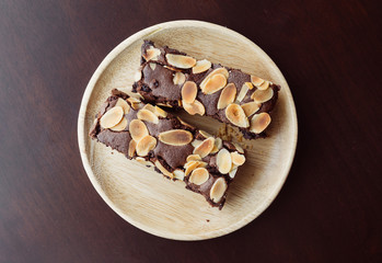 chocolate brownies on wood plate