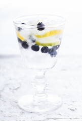Detox water cocktail,blueberry ,lime, lemon and ice.selective focus