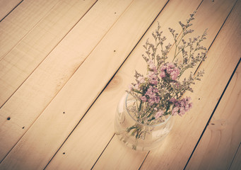 statice flower bouquet  on wood background