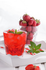 Strawberry drink with ice on a white background.selective focus