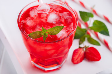 Strawberry drink with ice on a white background.selective focus