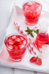 Strawberry drink with ice on a white background.selective focus