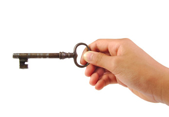 Hand holding an antique key isolated on a white background