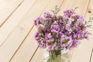 statice flower bouquet  on wood background