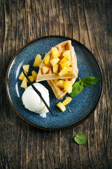 Belgian waffles with caramelized apple, ice cream and honey