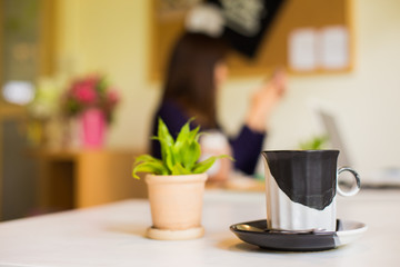 Selected focus art Latte Coffee in a cup on wooden table.