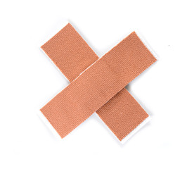 Plaster bands in cross shape