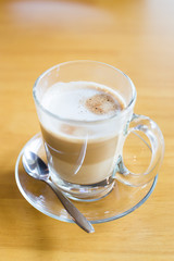 hot latte coffee on wooden table, vintage and retro style