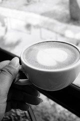 Drinking latte art coffee