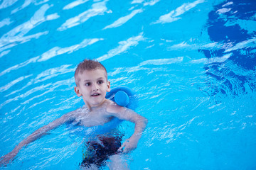 child on swimming poo