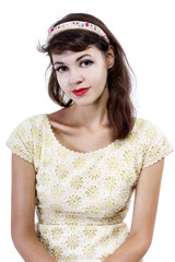 Portrait of a young female in old fashioned hairstyle makeup and clothes