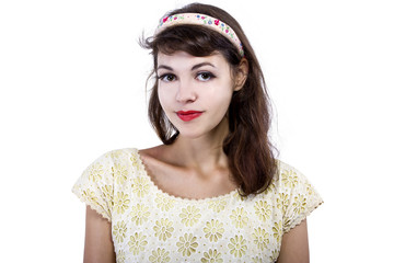 Portrait of a young female in old fashioned hairstyle makeup and clothes