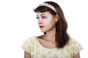 Portrait of a young female in old fashioned hairstyle makeup and clothes