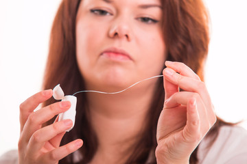 Woman uses dental thread