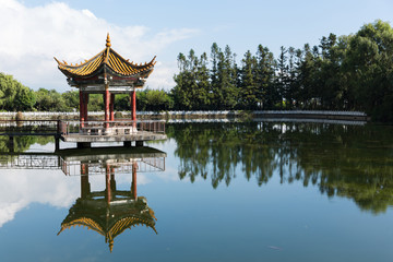 Naklejka premium ancient chinese pavilion in park