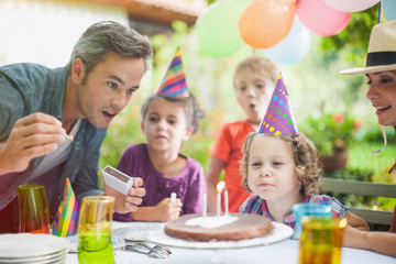Birthday girl making a wish