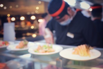 Blurred of japanese chef in restaurant