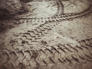 Wheel tracks on the soil.