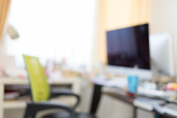 blur image background, computer on table work of workplace in bu