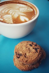 Chocolate chip cookies with latte art coffee