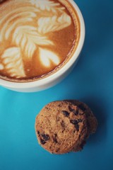 Chocolate chip cookies with latte art coffee