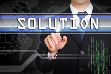 Businessman hand touching  Solution word by concept on screen.